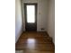 Entryway foyer with hardwood floors and front door with glass pane at 55 Gill Ln, Stockbridge, GA 30281