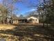 Traditional brick ranch home with shutters and covered front porch at 55 Gill Ln, Stockbridge, GA 30281