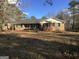 Traditional brick ranch home with shutters and covered front porch at 55 Gill Ln, Stockbridge, GA 30281