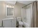 Bathroom with tub, toilet, sink, and mirror at 108 Adrian Dr, Stockbridge, GA 30281