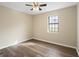 Bedroom with window, ceiling fan, and wood-look floors at 108 Adrian Dr, Stockbridge, GA 30281