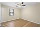 Simple bedroom with wood floors and a window at 108 Adrian Dr, Stockbridge, GA 30281