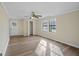 Bright bedroom with wood flooring, ceiling fan and exterior access at 108 Adrian Dr, Stockbridge, GA 30281
