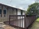 Back deck with wooden railings and backyard view at 108 Adrian Dr, Stockbridge, GA 30281