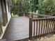 Back deck with wooden railings and backyard view at 108 Adrian Dr, Stockbridge, GA 30281