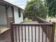 Back deck with wooden railings and backyard view at 108 Adrian Dr, Stockbridge, GA 30281
