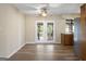Bright dining room with hardwood floors and French doors leading outside at 108 Adrian Dr, Stockbridge, GA 30281