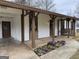 Ranch home features a covered porch,swing, and well-manicured flowerbeds at 108 Adrian Dr, Stockbridge, GA 30281