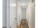 Hallway with wood-look flooring and light fixtures at 108 Adrian Dr, Stockbridge, GA 30281