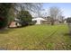 Back of house with covered patio and yard at 108 Adrian Dr, Stockbridge, GA 30281
