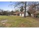 Single story home with side yard and trees at 108 Adrian Dr, Stockbridge, GA 30281