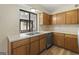 Kitchen with wood cabinets, stainless steel appliances, and a double sink at 108 Adrian Dr, Stockbridge, GA 30281