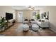 Bright living room with hardwood floors, comfy seating, and modern decor at 108 Adrian Dr, Stockbridge, GA 30281