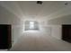 Unfinished bedroom with sloped ceiling and window at 1563 South Bethany Rd, Mcdonough, GA 30252