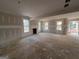 Large living room with fireplace and unfinished walls at 1563 South Bethany Rd, Mcdonough, GA 30252