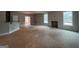 Bright living room with smooth concrete floors, ready for customization at 1563 South Bethany Rd, Mcdonough, GA 30252