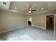 Spacious bedroom featuring a tray ceiling with recessed lighting, fresh paint, and plush carpeting at 1555 South Bethany Rd, Locust Grove, GA 30248