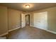Bedroom with a closet and open doorway, offering a spacious feel with neutral colors at 1555 South Bethany Rd, Locust Grove, GA 30248