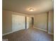 Bedroom featuring neutral carpeting, a closet, and a hallway entrance at 1555 South Bethany Rd, Locust Grove, GA 30248
