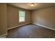 Bedroom showcasing neutral colors and a window letting in natural light at 1555 South Bethany Rd, Locust Grove, GA 30248