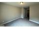 Cozy bedroom with neutral carpeting, fresh paint, and a spacious closet at 1555 South Bethany Rd, Locust Grove, GA 30248