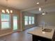 Open kitchen with granite countertops and stainless-steel sink and appliances at 1555 South Bethany Rd, Locust Grove, GA 30248