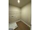 Laundry room with utility connections and durable, wood-look flooring at 1555 South Bethany Rd, Locust Grove, GA 30248