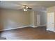 Spacious living room with wood floors, neutral walls, and ceiling fan at 1555 South Bethany Rd, Locust Grove, GA 30248
