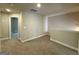 Loft area features neutral carpeting, fresh paint, and an open doorway at 1555 South Bethany Rd, Locust Grove, GA 30248