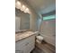 Bathroom with granite countertops, vanity, toilet, and tub shower combo at 1547 South Bethany Rd, Locust Grove, GA 30248
