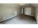 Spacious bedroom with carpet, neutral walls, and closet doors at 1547 South Bethany Rd, Locust Grove, GA 30248