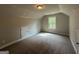 Neutral bedroom featuring carpet, neutral walls, and a window with natural light at 1547 South Bethany Rd, Locust Grove, GA 30248