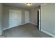 Bedroom featuring a closet with white paneled doors and neutral colored walls at 1547 South Bethany Rd, Locust Grove, GA 30248