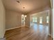 Bright dining area with wood floors, open to the kitchen and living areas at 1547 South Bethany Rd, Locust Grove, GA 30248