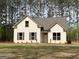 Charming single-Gathering home showcasing a well-manicured lawn and inviting facade at 1547 South Bethany Rd, Locust Grove, GA 30248
