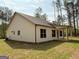 Exterior of a two-story home featuring white siding and dark trim at 1547 South Bethany Rd, Locust Grove, GA 30248