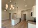 Modern kitchen with a large island, granite countertops, and stainless steel appliances at 1547 South Bethany Rd, Locust Grove, GA 30248