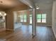 Open-concept living area featuring plenty of natural light and wood-look flooring at 1547 South Bethany Rd, Locust Grove, GA 30248