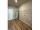 Utility room features a water heater, shelving, and a door to the outside at 1547 South Bethany Rd, Locust Grove, GA 30248