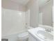 Clean bathroom featuring a tub/shower combination and a white vanity with sink at 334 Royal Crescent Way, Stockbridge, GA 30281