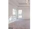 Bright bedroom with two windows and neutral carpet at 334 Royal Crescent Way, Stockbridge, GA 30281