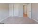 Bedroom featuring neutral carpet and a closet at 334 Royal Crescent Way, Stockbridge, GA 30281
