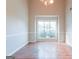 Bright dining room featuring hardwood floors, a large window and decorative trim at 334 Royal Crescent Way, Stockbridge, GA 30281