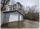 Detached garage with double doors and additional storage space at 9267 Westview Sw Dr, Covington, GA 30014