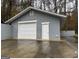Detached garage with double doors and additional storage space at 9267 Westview Sw Dr, Covington, GA 30014