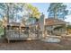 Home exterior with deck and landscaped yard at 5130 Otter Creek Run, Cumming, GA 30040