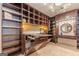 Spacious laundry room with custom cabinetry and built-in ironing board at 5130 Otter Creek Run, Cumming, GA 30040