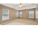 Bright bedroom with three windows and neutral walls at 512 Hillside Trl, Woodstock, GA 30188