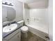 Clean bathroom featuring a vanity, toilet, and a shower-tub combination at 4405 Cary Dr, Snellville, GA 30039