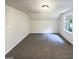 Empty bedroom offering lots of space and natural light from a window at 4405 Cary Dr, Snellville, GA 30039